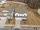 Aerial view of a home highlighting its front elevation, driveway, and landscaping at 1026 Janiskee Rd, Durham, NC 27703