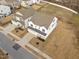 Aerial shot of a two-story home boasting a two-car garage and an inviting front porch at 1026 Janiskee Rd, Durham, NC 27703