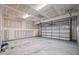 Two car garage with overhead door and a concrete floor at 1026 Janiskee Rd, Durham, NC 27703