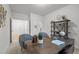 Bright home office featuring a wooden desk with a bookshelf and stylish chairs for a productive workspace at 1026 Janiskee Rd, Durham, NC 27703