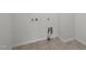 Utility room with hookups for laundry appliances and tile floor at 1026 Janiskee Rd, Durham, NC 27703