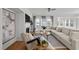 Spacious living room featuring a fireplace and tv, large windows with natural light, and comfortable seating at 1026 Janiskee Rd, Durham, NC 27703