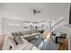 Open-concept living room showcasing modern white cabinets and an expansive island with pendant lighting at 1026 Janiskee Rd, Durham, NC 27703