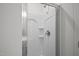 Shower with glass doors, chrome fixture and built-in shelving at 1026 Janiskee Rd, Durham, NC 27703