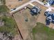 A high angle aerial view of the property and backyard featuring a fenced-in perimeter and mature trees at 1028 Allaire Dr, Raleigh, NC 27603