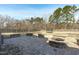 A spacious backyard with a brick patio and fire pit, perfect for outdoor entertaining and relaxing at 1028 Allaire Dr, Raleigh, NC 27603