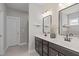 Bathroom with double vanity sinks, mirrors, tile backsplash and lots of counter space at 1028 Allaire Dr, Raleigh, NC 27603