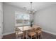 Dining room with modern chandelier and a view to the outside at 1028 Allaire Dr, Raleigh, NC 27603
