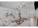 Cozy living room with an open floor plan, neutral colors, and dark wood floors, creating a warm and inviting atmosphere at 1028 Allaire Dr, Raleigh, NC 27603