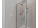 Tiled shower with glass door and rainfall showerhead at 1028 Allaire Dr, Raleigh, NC 27603
