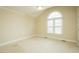 Cozy bedroom with neutral carpet, large window, and a vaulted ceiling at 104 E Laramie Dr, Mebane, NC 27302