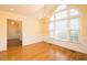 Bright dining area boasting hardwood floors, ample natural light, and elegant chandelier at 104 E Laramie Dr, Mebane, NC 27302