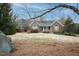 Charming brick home with a manicured front lawn and welcoming porch at 104 E Laramie Dr, Mebane, NC 27302