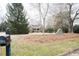 Brick home featuring an established yard, trees and easy mailbox access at 104 E Laramie Dr, Mebane, NC 27302