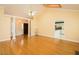 Open-concept living room with hardwood floors and elegant columns at 104 E Laramie Dr, Mebane, NC 27302