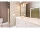 Main bathroom features a vanity with double sinks and a standing shower at 104 E Laramie Dr, Mebane, NC 27302
