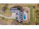 Magnificent aerial view of the estate with in-ground pool and a fire pit feature at 108 Springfield Pl, Hillsborough, NC 27278
