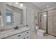 Elegant bathroom boasts granite countertops, sleek fixtures, and a walk-in shower with beautiful tile work at 108 Springfield Pl, Hillsborough, NC 27278