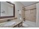 Updated bathroom with granite counter, tile surround, and modern fixtures at 108 Springfield Pl, Hillsborough, NC 27278