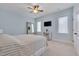 Bedroom features blue walls, ceiling fan, and carpet flooring at 108 Springfield Pl, Hillsborough, NC 27278