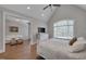 Bright bedroom with hardwood floors, vaulted ceiling, and a sitting area at 108 Springfield Pl, Hillsborough, NC 27278