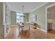 Bright dining room featuring wood floors, soft paint and a chandelier at 108 Springfield Pl, Hillsborough, NC 27278