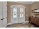 Elegant foyer featuring double doors, slate flooring and decorative wood furnishings at 108 Springfield Pl, Hillsborough, NC 27278