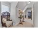 Hallway featuring decor, a sitting chair, and a view to exercise room at 108 Springfield Pl, Hillsborough, NC 27278