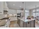 This spacious kitchen boasts a large island with seating and stainless steel appliances at 108 Springfield Pl, Hillsborough, NC 27278