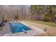Gorgeous in-ground pool with diving board and beautiful lush backyard at 108 Springfield Pl, Hillsborough, NC 27278