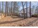 Spacious backyard features mature trees, large deck, and plenty of room for outdoor activities at 112 Solstice Cir, Cary, NC 27513