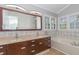 Bathroom features dual sinks, tile backsplash, and soaking tub at 112 Solstice Cir, Cary, NC 27513