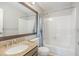 Bathroom featuring granite countertops, large mirror, shower and tub combination and plenty of natural light at 112 Solstice Cir, Cary, NC 27513