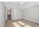 Bright empty bedroom with laminate flooring at 112 Solstice Cir, Cary, NC 27513