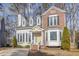 Charming two-story home featuring a mix of brick and siding, complemented by a bright yellow front door at 112 Solstice Cir, Cary, NC 27513