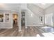 Open-concept layout showcasing the living room's wood floors, neutral walls, and seamless flow to other spaces at 112 Solstice Cir, Cary, NC 27513