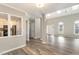 Bright and airy living space with wood floors, neutral paint, a skylight, and ample natural light at 112 Solstice Cir, Cary, NC 27513
