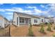 Inviting backyard featuring a screened porch, perfect for relaxing and enjoying the outdoors at 119 Canary Ct, Raleigh, NC 27610