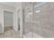 Bathroom featuring a glass shower with tiled walls and a built-in bench seat at 119 Canary Ct, Raleigh, NC 27610