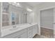 Bathroom with a large vanity, double sinks, and a large mirror at 119 Canary Ct, Raleigh, NC 27610