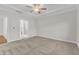 Large bedroom with a ceiling fan and carpet flooring at 119 Canary Ct, Raleigh, NC 27610
