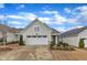 Charming home with a two-car garage, well-maintained landscaping, and a welcoming entrance at 119 Canary Ct, Raleigh, NC 27610