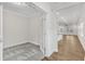 Open office with neutral walls and carpet, featuring a view of the kitchen and living area at 119 Canary Ct, Raleigh, NC 27610