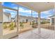 A screened porch overlooks the fenced backyard at 119 Canary Ct, Raleigh, NC 27610