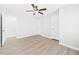 Bedroom with new ceiling fan, updated flooring and two entry doors at 1201 Clematis St, Knightdale, NC 27545