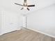 Bedroom with laminate flooring and a closet with white doors at 1201 Clematis St, Knightdale, NC 27545