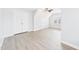 A spacious bedroom features light gray walls and floors, a closet, and a large window at 1201 Clematis St, Knightdale, NC 27545
