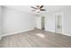 An empty bedroom with a ceiling fan and an attached bathroom at 1201 Clematis St, Knightdale, NC 27545