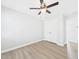 Bedroom with laminate flooring, ceiling fan and closet with white doors at 1201 Clematis St, Knightdale, NC 27545