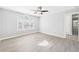 Neutral bedroom with a large window and attached bathroom at 1201 Clematis St, Knightdale, NC 27545